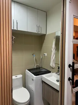 a small bathroom with a toilet and a sink at 2BR Unit in SMDC Shore 3 with pool access in Manila