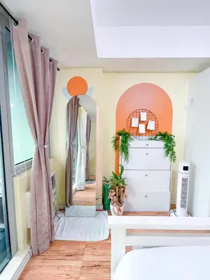 a bedroom with a dresser and a mirror at Azure Urban Resort Residences - stayCAOtion in Manila