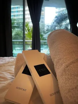 two boxes sitting on top of a bed with a window at Azure Urban Resort Residences - stayCAOtion in Manila