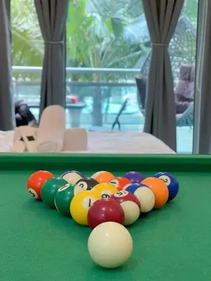 a group of billiard balls on a pool table at Azure Urban Resort Residences - stayCAOtion in Manila