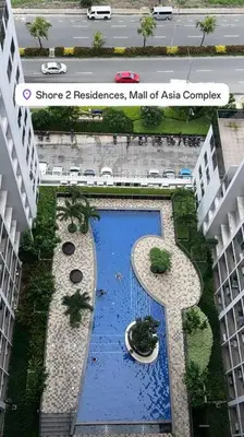 an overhead view of a building with a blue door at 19106 Condotel at Shore 2 MOA wNetflix in Manila