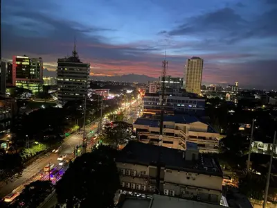 a view of a city at night with buildings at Condo near ATC- Molito Alabang, Muntinlupa in Manila