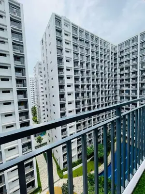 an apartment balcony with buildings in the background at Mitch serene shore in Manila