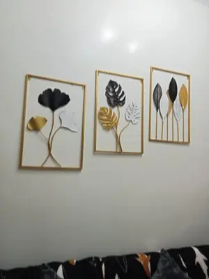 four framed pictures of flowers on a wall at Spring Residences 2BR R&D Staycation and Condotel in Manila