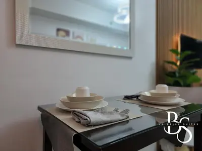 a table with plates and dishes on top of it at The Beacon Makati New Renovated Studio Ayala Greenbelt CBD Makati PH in Manila