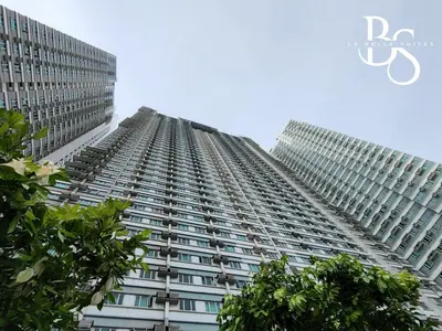 a tall building with trees in front of it at The Beacon Makati New Renovated Studio Ayala Greenbelt CBD Makati PH in Manila