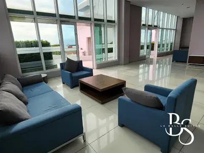 a living room with two blue couches and a coffee table at The Beacon Makati New Renovated Studio Ayala Greenbelt CBD Makati PH in Manila