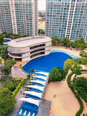 an overhead view of a building with a swimming pool at Oveecation Suites St Tropez Tower in Manila