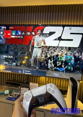 a person holding a video game controller in front of a television at Oveecation Suites Positano Smarthome in Manila