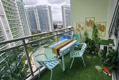 a balcony with a table and chairs on a balcony at Urban Resort luxury Staycation at Azure Residences Rio Tower in Manila
