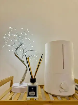 a white blender sitting on a table with some sticks at Azure Urban Resort Residences Maui Tower in Manila