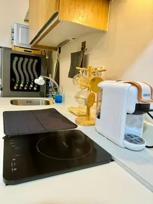 a kitchen with a counter with a toaster and a sink at Azure Urban Resort Residences Maui Tower in Manila