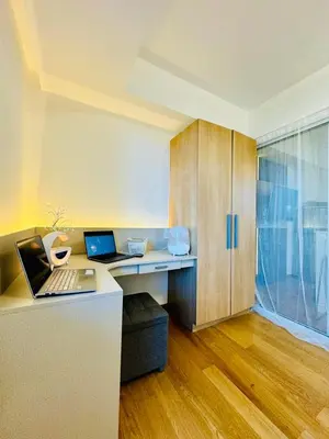 an office with a desk with two laptops on it at Azure Urban Resort Residences Maui Tower in Manila
