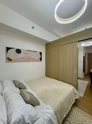 a bedroom with two beds in a room at Taguig - Modern Luxe at Grace Residences in Manila