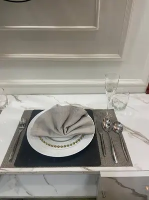 a plate with a napkin on top of a table at AIR RESIDENCES Makati Netflix plus 200 mbps digital door lock in Manila