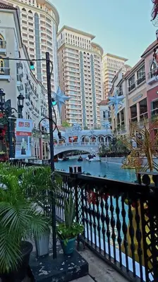 a view of a river in a city with buildings at Luxury Bohemian Suite Venice Canal Mall & BGC Views in Manila