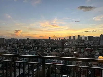 a view of a city skyline at sunset at Prime End Sunset View Unit in Makati in Manila