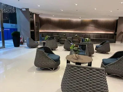 a lobby with chairs and a table and a waiting room at Shore Family Suite 2 beds for 4 pax TV Netflix WiFi Near MOA NAIA 9116 in Manila