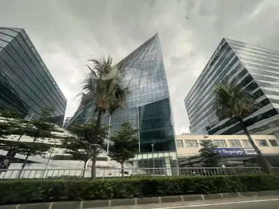 two tall buildings with palm trees in front of them at Shore Family Suite 2 beds for 4 pax TV Netflix WiFi Near MOA NAIA 9116 in Manila