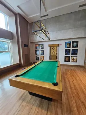 a room with a pool table in a room at Luxury Apartment at Park Mckinley West suite 2 in Manila