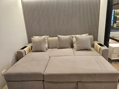 a large couch in a living room at Luxury Apartment at Park Mckinley West suite 2 in Manila