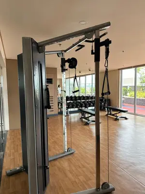 a gym with several treadmills and machines at The Verdin in General Trias
