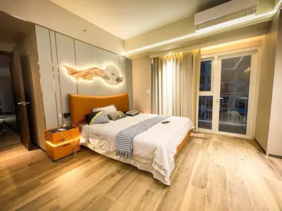 a bedroom with a large bed and a large window at Luxury 1BR beside Okada Manila in Manila
