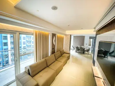 a large living room with a couch and a television at Luxury 1BR beside Okada Manila in Manila