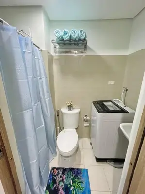 a small bathroom with a toilet and a sink at Ocean Room 677 Shore 2 Tower 3 MOA Complex, Pasay City in Manila