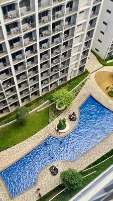 an overhead view of a swimming pool in front of a building at CASA ROSITA Staycation by 3MR in Manila