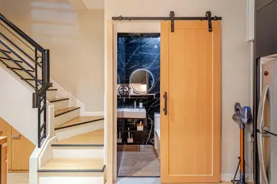 a door leading into a room with stairs at MUJI TOWNHOUSE SUITE in Central Makati BILLIARDS, KTV in Manila