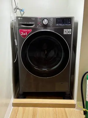 a black microwave oven in a corner of a room at MUJI TOWNHOUSE SUITE in Central Makati BILLIARDS, KTV in Manila