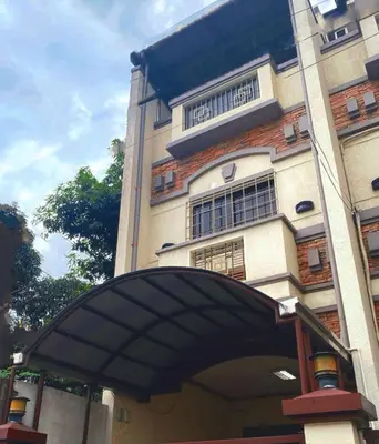 a building with an arch in front of it at MUJI TOWNHOUSE SUITE in Central Makati BILLIARDS, KTV in Manila
