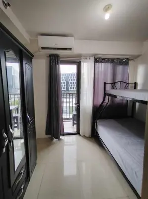 a room with two bunk beds and a balcony at Shore Residences Tower D - 2 Bunkbed Ideal for 6 guests in Manila