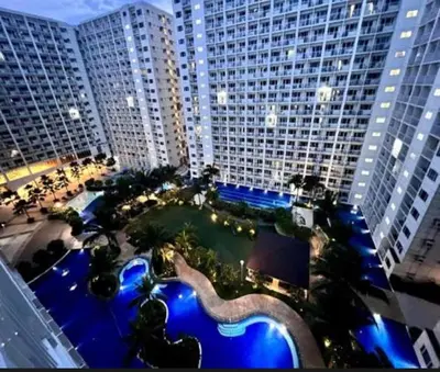 an overhead view of a large building with a swimming pool at BIG CUT, END UNIT in SHORE RESIDENCES in Manila