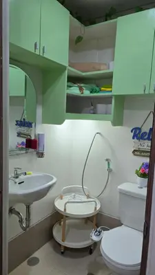 a bathroom with a toilet and a sink at SMDC Spring Resort Residences in Manila