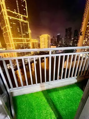 a balcony with a white fence and a city skyline at Rockwell View Acqua Iguazu Tower 17th flr Mandaluyong-Makati 1BR in Manila