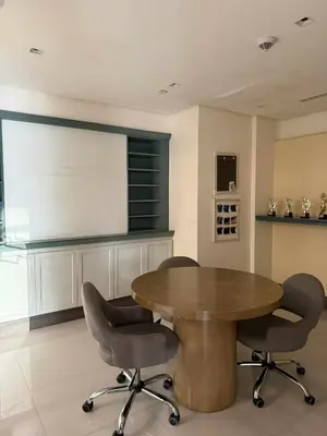 a conference room with a wooden table and chairs at Venice Vista Lodge Staycation connected to Venice Grand Canal in Manila