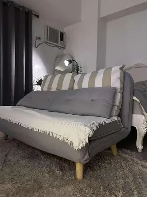 a bed sitting in a room with azeb at Venice Vista Lodge Staycation connected to Venice Grand Canal in Manila