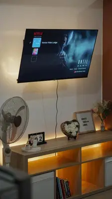 a flat screen tv hanging on a wall at Venice Vista Lodge Staycation connected to Venice Grand Canal in Manila