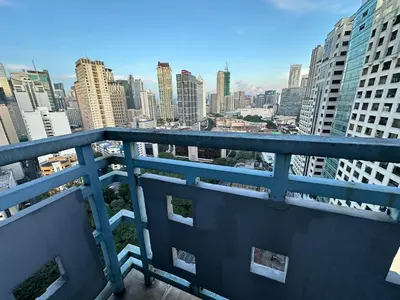 a view of a city skyline from a balcony at Newly Renovated 2-Storey Loft at Greenbelt 1 in Manila