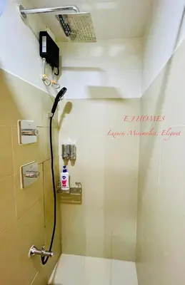 a bathroom with a shower with a shower at EJ Homes - Shore 3 Residences in Manila