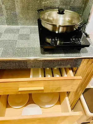 a stove with a pot on top of it at Subway House in Paranaque in Manila