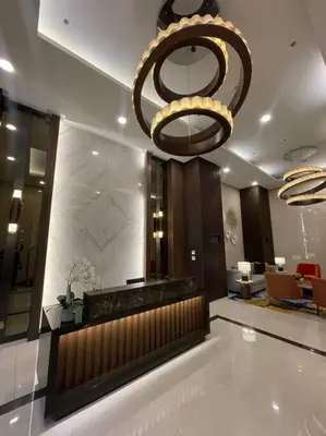 a lobby with a large chandelier in a hotel at Luxury 1 Bedroom across Okada II Balcony w View in Manila