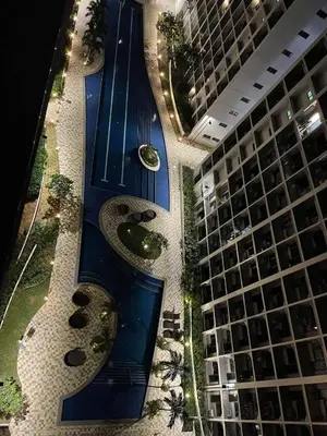 an overhead view of a building with a swimming pool at Tower 3 Shore 2 High Floor 1BR Good 4PAX in Manila