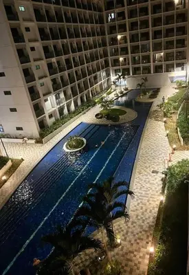 an empty swimming pool in a large building at Tower 3 Shore 2 High Floor 1BR Good 4PAX in Manila