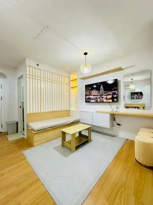 a living room with a couch and a table at Tiffany's Place in Imus