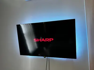 a black sign with the shrap on a wall at Affordable 1BR Staycation at One Uptown BGC in Manila