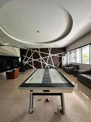 a room with a table in the middle of a room at Dsa'sCrib 1BR Azure Near Airport in Manila