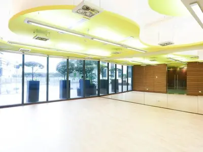 a large empty room with glass doors and a large room with a large room at High Floor 2BR in Knightsbridge Residences Makati in Manila